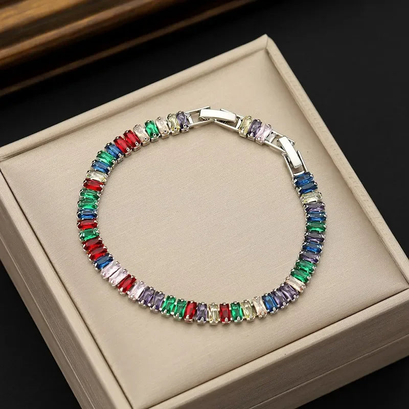 Multicolored gemstone bracelet on a beige jewelry box