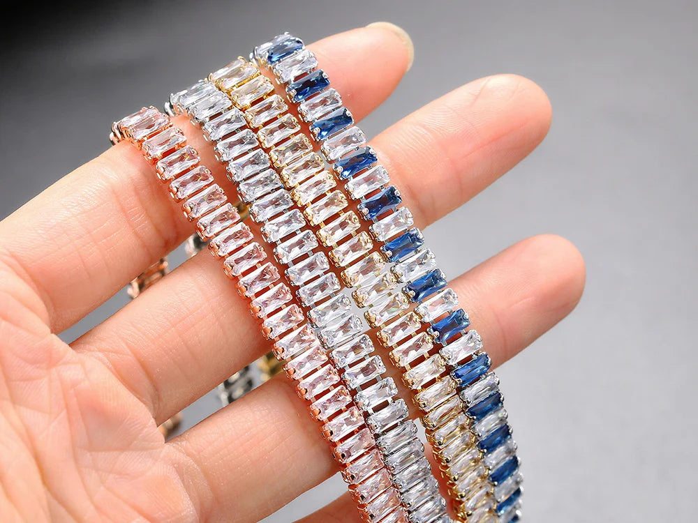 Three diamond bracelets on a hand with a blurred background