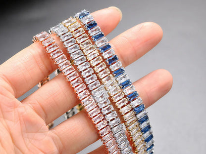 Three diamond bracelets on a hand with a blurred background